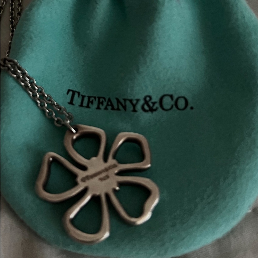 Authentic RetiredTiffany hibiscus charm w/necklace with Tiffany bag.